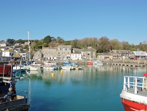 A harbor with boats docked, buildings along the shore, and a clear sky. - 2 bedroom accommodation in St Merryn, near Padstow (St Merryn, near Padstow)
