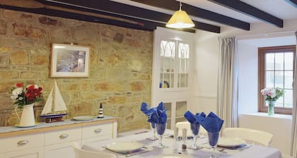 A beamed, character cottage situated just 100 yards from the River Teifi.