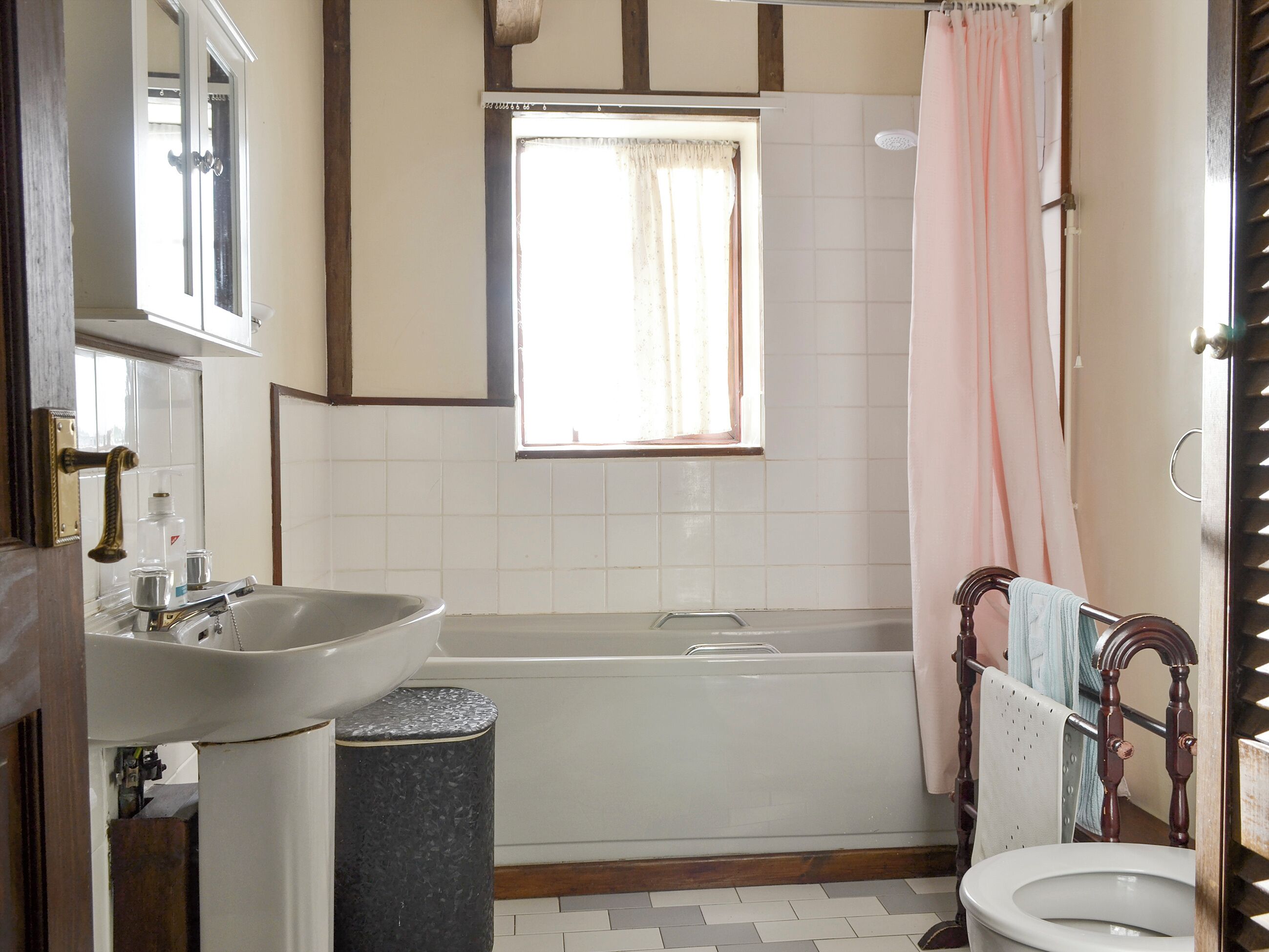A bathroom with a sink, bathtub, and toilet.