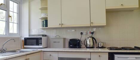 Highchair, cookware/dishes/utensils, freezer
