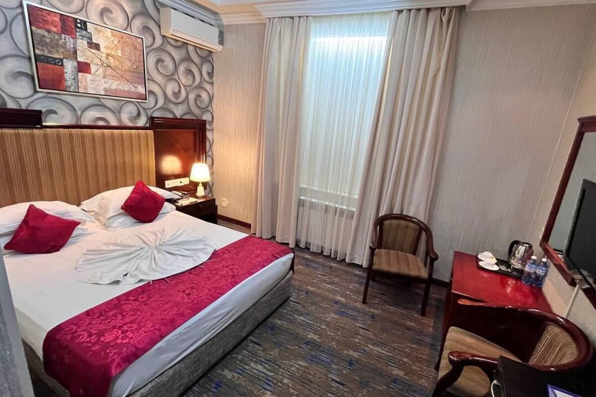 Chambre Double Économique, pas de fenêtre | Minibar, bureau, fer et planche à repasser, Wi-Fi gratuit