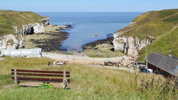 A coastal view with cliffs, a beach, and a bench. - 2 bedroom accommodation in Flamborough, near Bridlington (Flamborough, near Bridlington)