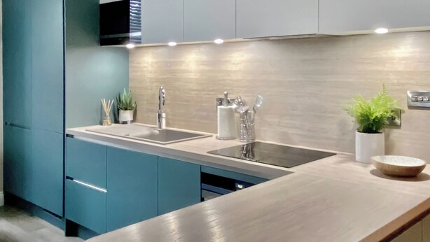 A modern kitchen with a light wood countertop, a double sink, and teal cabinets. - 2 bedroom accommodation in Portinscale, near Keswick (Portinscale, near Keswick)