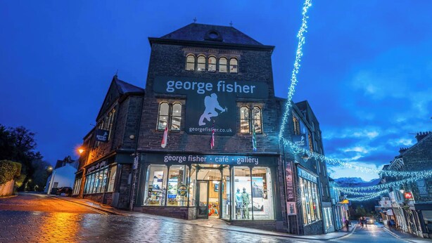 A building with a sign reading "George Fisher cafe gallery" and a website address "georgefisher.co.uk". - 1 bedroom accommodation in Keswick (Keswick)