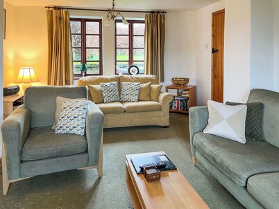 A detached farmhouse with views down the Derwent Valley.
