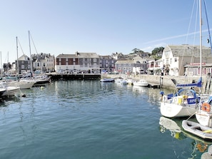 A harbor with boats docked, buildings along the waterfront, and a clear sky. - 3 bedroom accommodation in Padstow (Padstow)