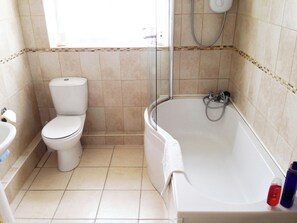 A bathroom with a toilet, sink, and bathtub. - Jug And Glass Cottage (Nether Langwith, near Mansfield)