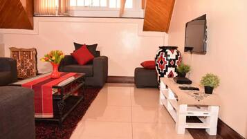 Apartment, 1 Double Bed, Non Smoking | Living room | Flat-screen TV