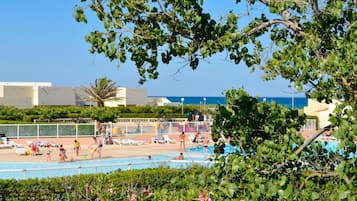 Outdoor pool, open 9:00 AM to 8:00 PM, pool umbrellas, pool loungers