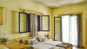 A hotel room with two beds, a desk, and a chair. - SunRose Beach Aparthotel (Corfu)