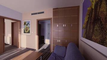 Une chambre moderne avec un canapé, une grande armoire en bois et un tableau représentant un tournesol, encadré, accroché au mur.