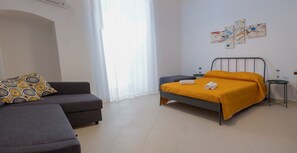 Family Room, Private Bathroom (1) | Down comforters, individually furnished, desk, blackout drapes - Enjoy Trani (Trani)