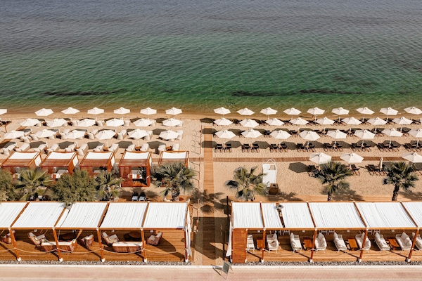 On the beach, sun loungers, beach umbrellas
