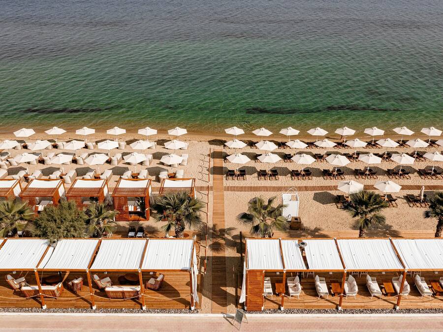 On the beach, sun-loungers, beach umbrellas