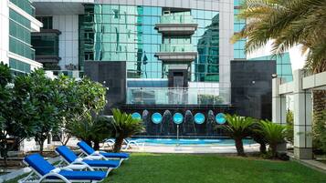 Outdoor pool, open 7:00 AM to 8:00 PM, pool umbrellas, pool loungers