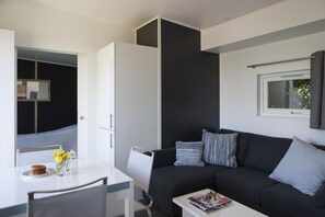 Chalet, 2 Bedrooms | Living room | Flat-screen TV, table tennis - Strand 49 Camping & Glamping (Sint Maartensbrug)