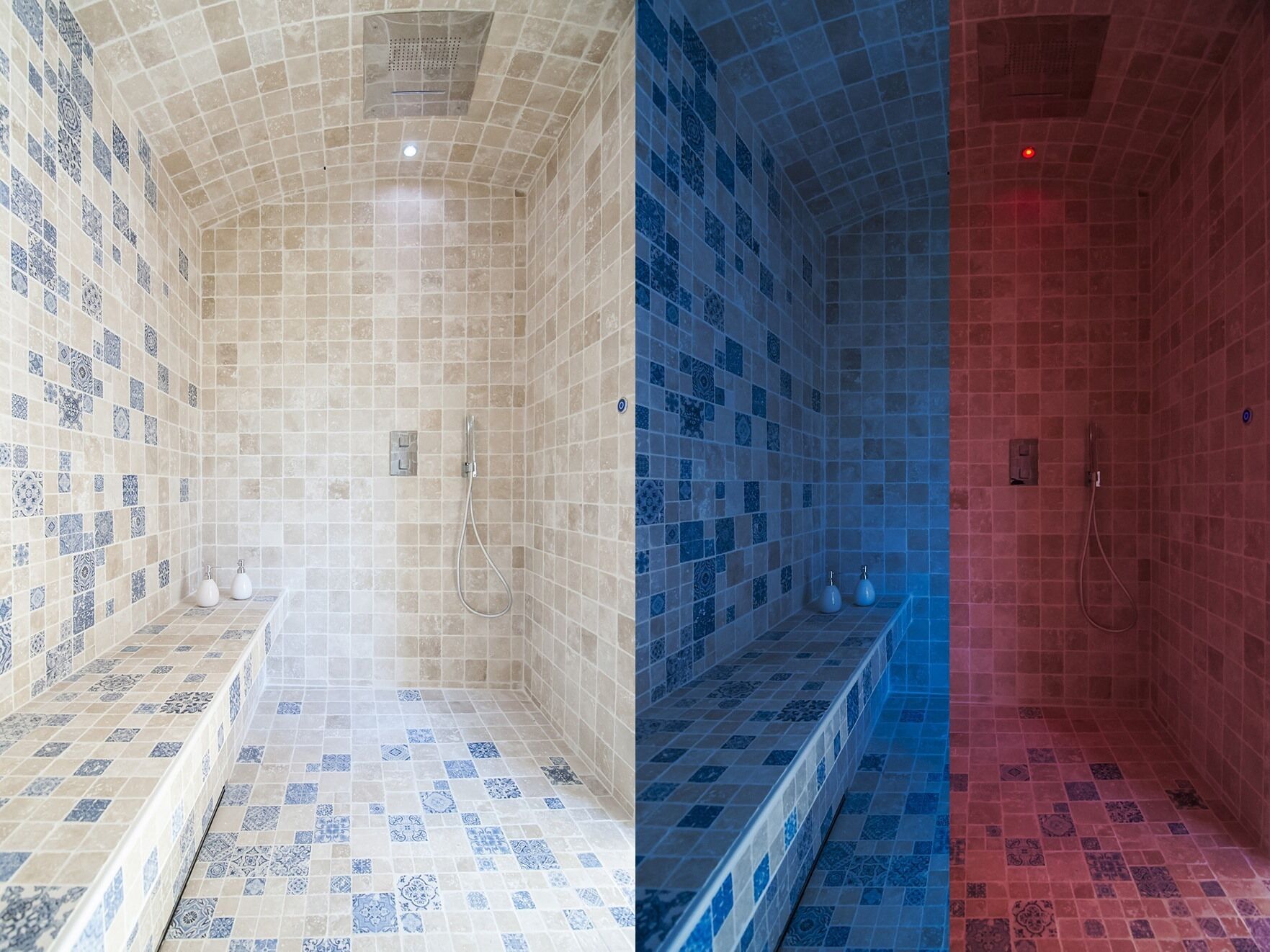 Une salle de bain avec une douche carrelée, un banc et un luminaire fixé au mur.