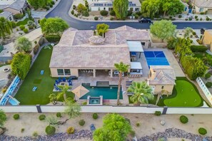 A residential property with a swimming pool, tennis court, and landscaped garden. - Azul: Pool, Spa, Fire Pit and Pickle Ball Court! (Indio)
