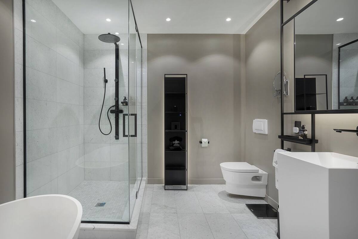 designer toiletries, hair dryer, bathrobes, slippers