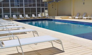 Outdoor pool, open 11:00 AM to 8:00 PM, pool umbrellas, pool loungers