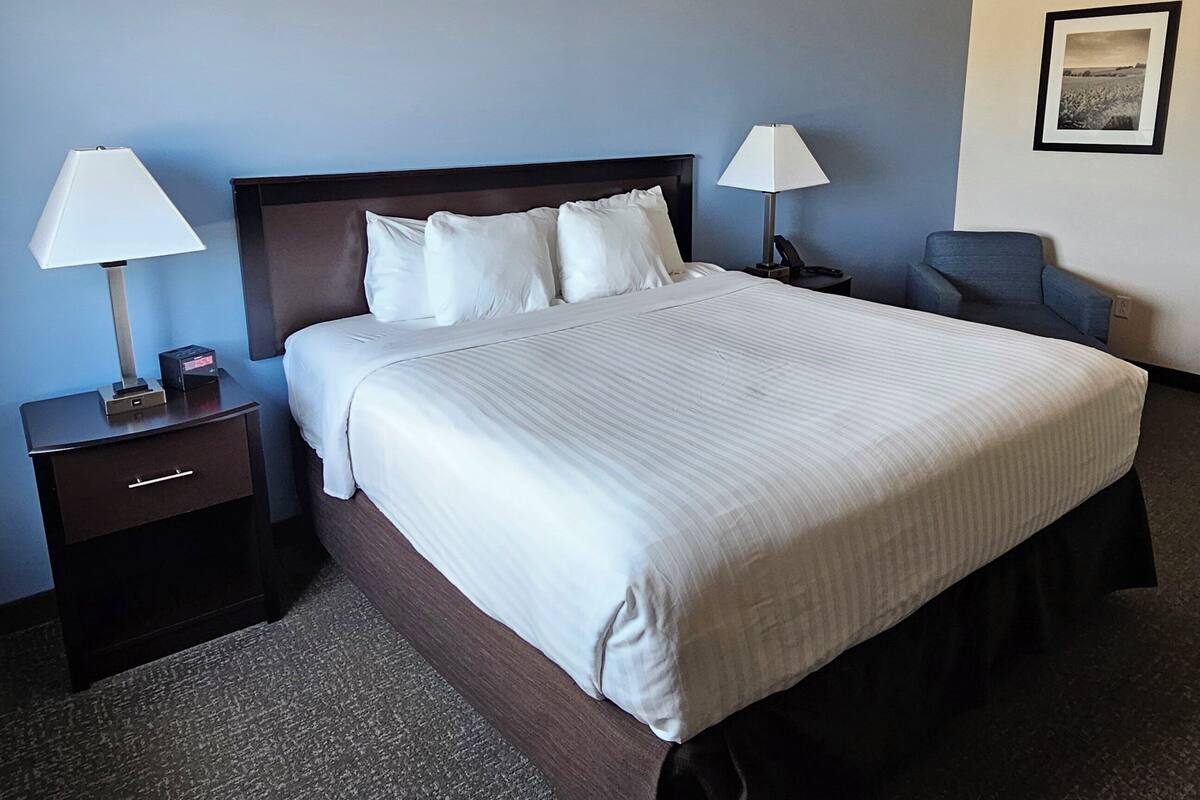 premium bedding, pillow-top beds, desk, laptop workspace