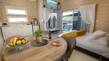 Luxury Suite, Multiple Beds, Non Smoking, Pool View | Premium bedding, free minibar, desk, laptop workspace