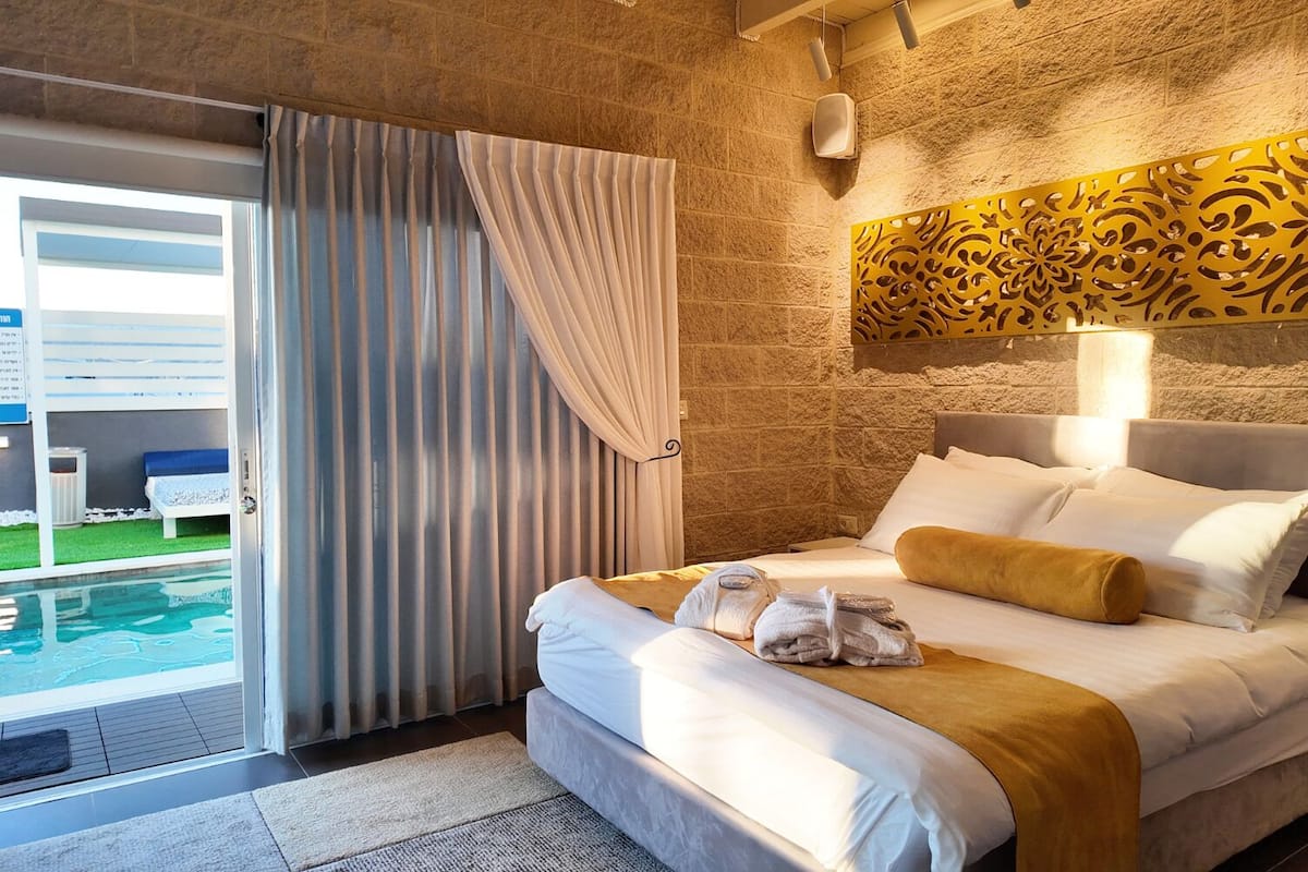 Luxury Suite, Multiple Beds, Non Smoking, Pool View | Premium bedding, memory foam beds, minibar (free items), desk