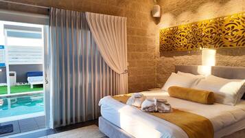 Luxury Suite, Multiple Beds, Non Smoking, Pool View | Premium bedding, minibar (free items), desk, laptop workspace