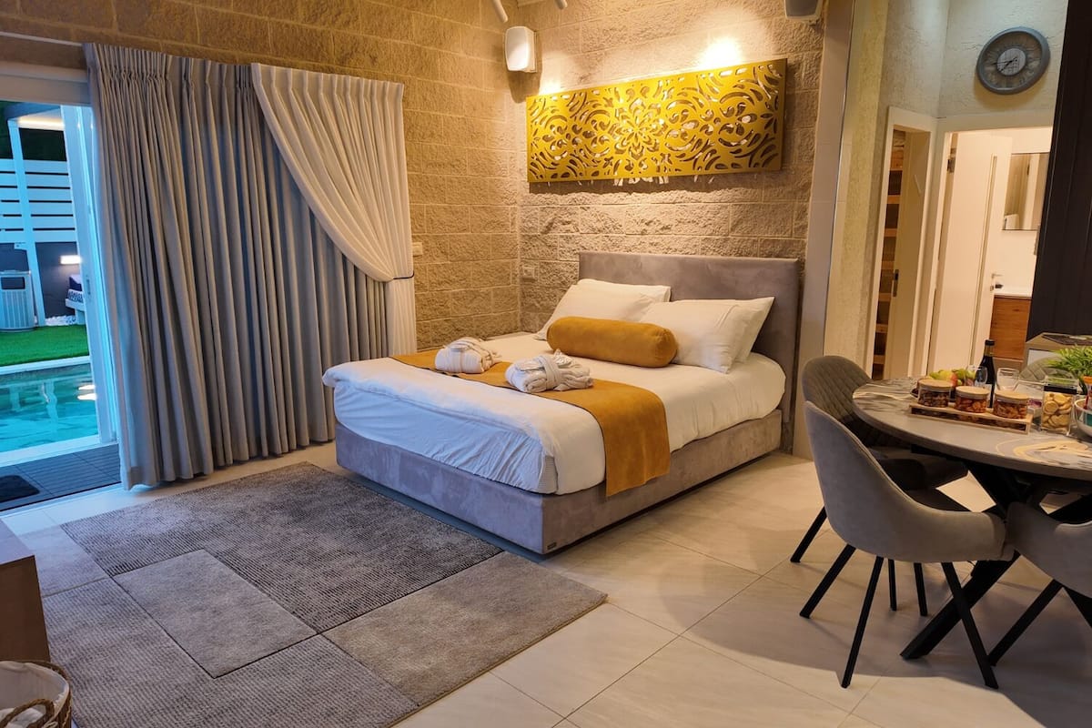 Luxury Suite, Multiple Beds, Non Smoking, Pool View | Premium bedding, memory foam beds, minibar (free items), desk
