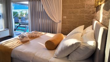 Luxury Suite, Multiple Beds, Non Smoking, Pool View | Premium bedding, memory-foam beds, free minibar, desk