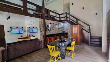Family House, Kitchenette, Garden View | Living area | 43-inch Smart TV with cable channels, Netflix, streaming services