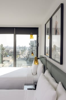 City Double Queen, Non Smoking | Minibar, in-room safe, desk, laptop workspace at The Godfrey Hotel Hollywood