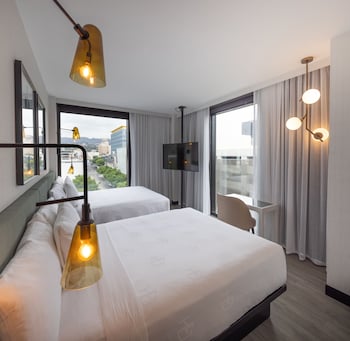 Hollywood Double Queen, Non Smoking | Minibar, in-room safe, desk, laptop workspace at The Godfrey Hotel Hollywood