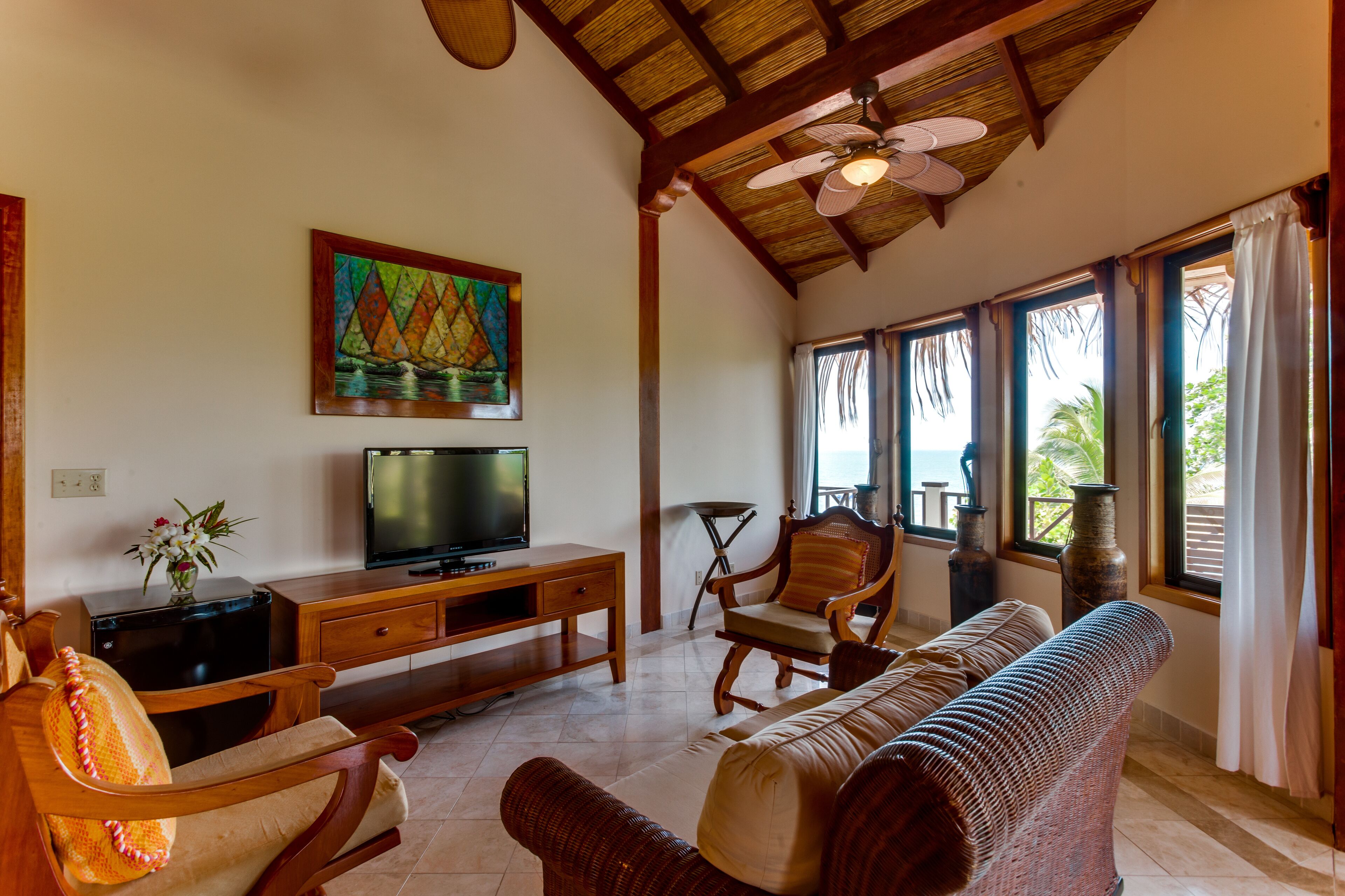 colonial penthouse room | living area | flat-screen tv