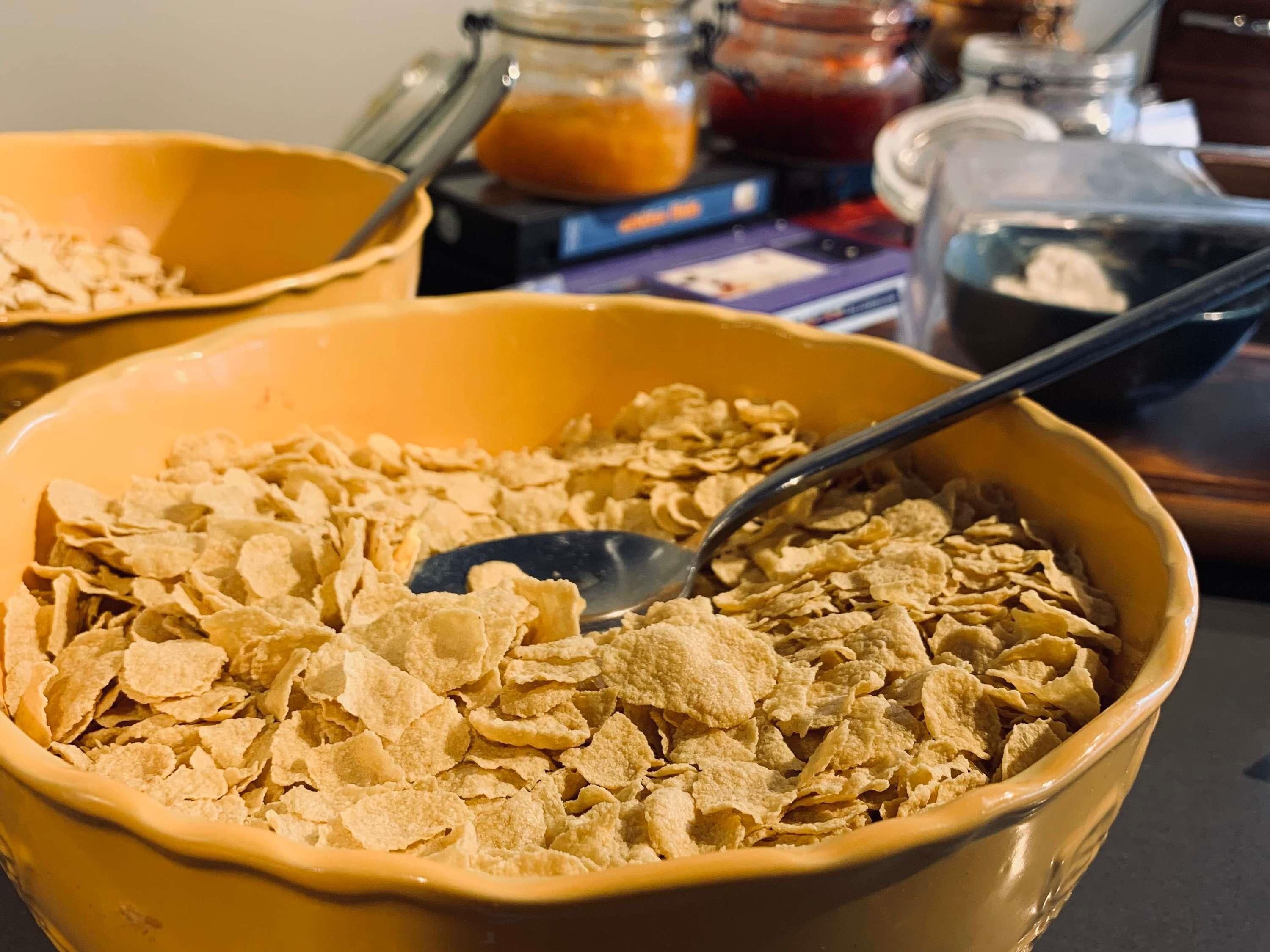A bowl of cereal with a spoon in it.