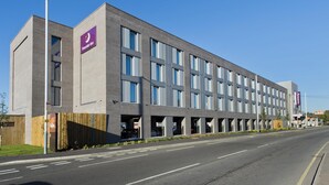 A modern building with a prominent 'Premier Inn' sign, multiple windows, and a flat roof. - Premier Inn London Hayes Heathrow - Hyde Park (Hayes)