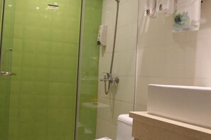 A bathroom with a glass-enclosed shower, a white toilet, and a beige countertop with a sink. - 8 Inn (Dongguan Dongkeng) (Dongguan)