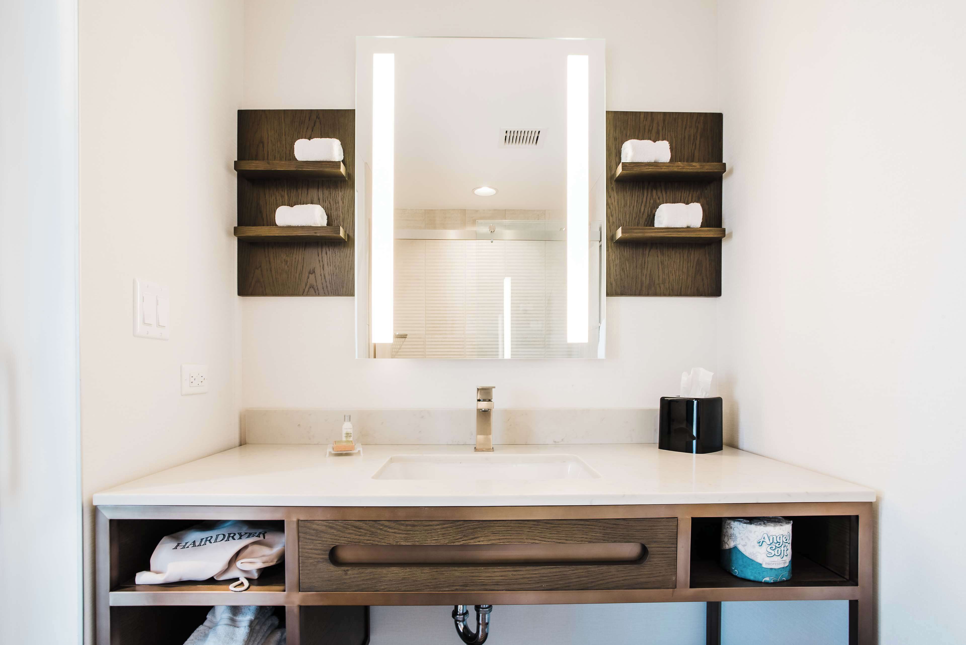 rainfall showerhead, designer toiletries, hair dryer, towels