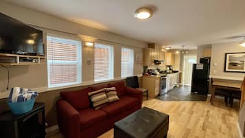 Cottage (Waterfront 2 bedroom Cottage with Hot) | Living room | TV, fireplace, DVD player