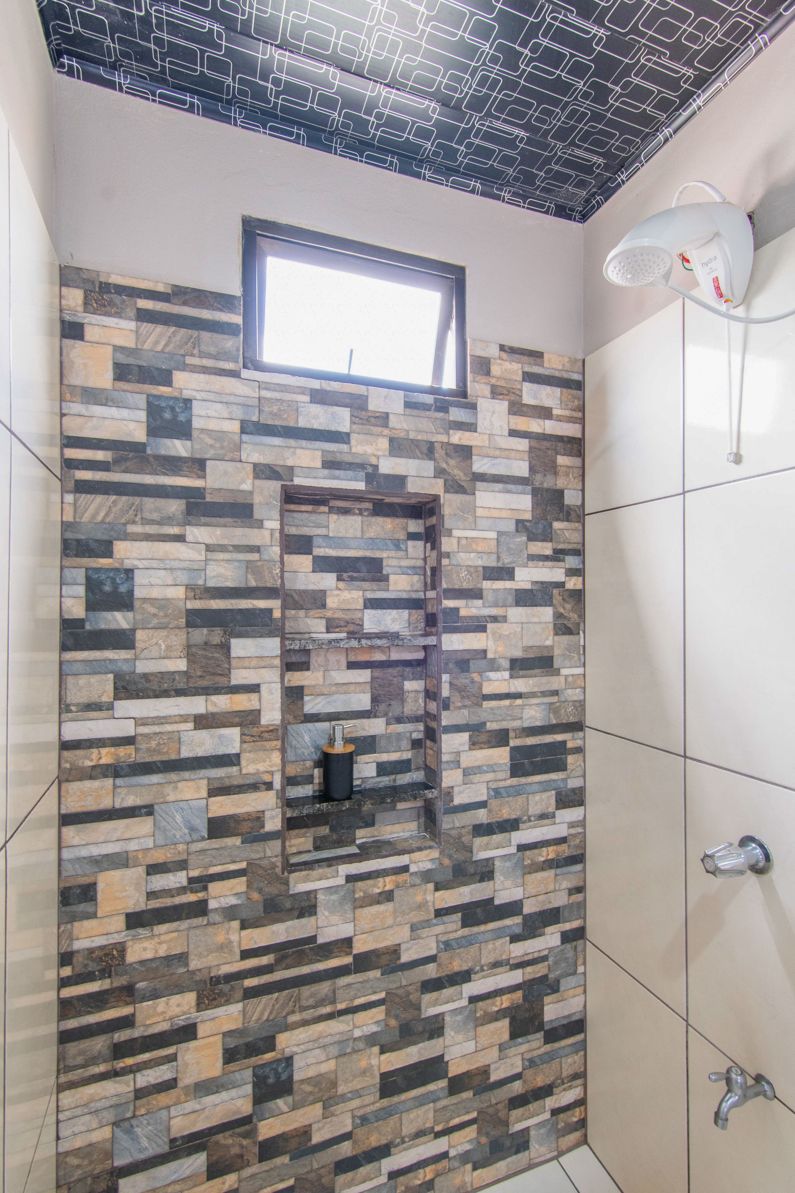 Family Apartment, 2 Bedrooms (Casa Monarca) | Bathroom | Shower, rainfall showerhead, hair dryer, towels
