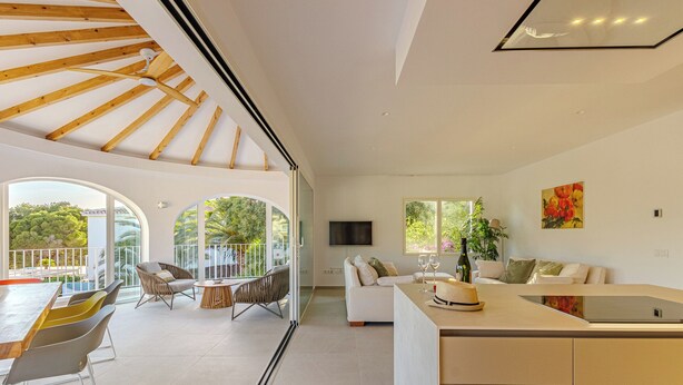 A modern interior with a dining area, a living room, and a kitchen. - Villa Mar Alborán, Great Seaviews, 5-10 Min Easy Stroll Town & Beaches (Moraira)