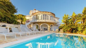 A large, luxurious house with a swimming pool, outdoor seating, and tropical vegetation. - Villa Mar Alborán, Great Seaviews, 5-10 Min Easy Stroll Town & Beaches (Moraira)