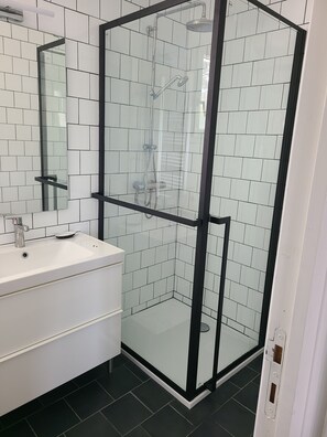 Shower, hair dryer, towels, soap