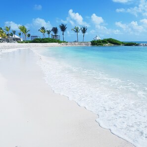 On the beach, sun loungers, beach towels