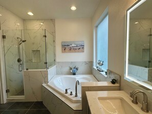 Combined shower/tub, hair dryer, towels, soap