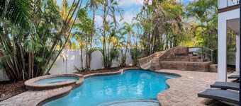 Amazing home with WATERSLIDE! One Block off beach! Life is Just Beachy here!