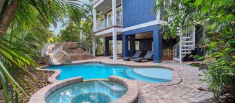 Amazing home with WATERSLIDE! One Block off beach! Life is Just Beachy here!