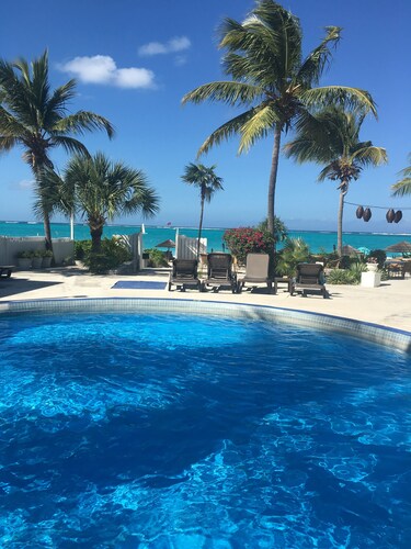 Walk Out of this Elegant 2 Bedroom Condominium On To Stunning Grace Bay Beach!