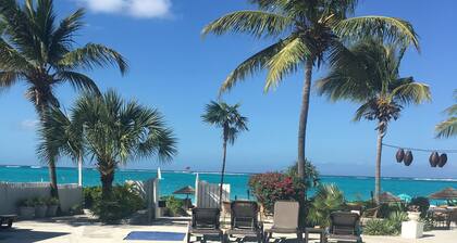 Walk Out of this Elegant 2 Bedroom Condominium On To Stunning Grace Bay Beach!