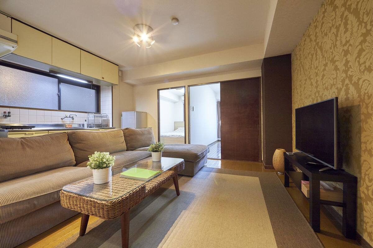 Triple Room 201 | Living area | Flat-screen TV